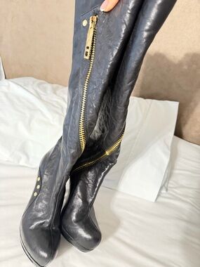 Black Over-the-Knee Leather Boots with Gold Zipper Accents